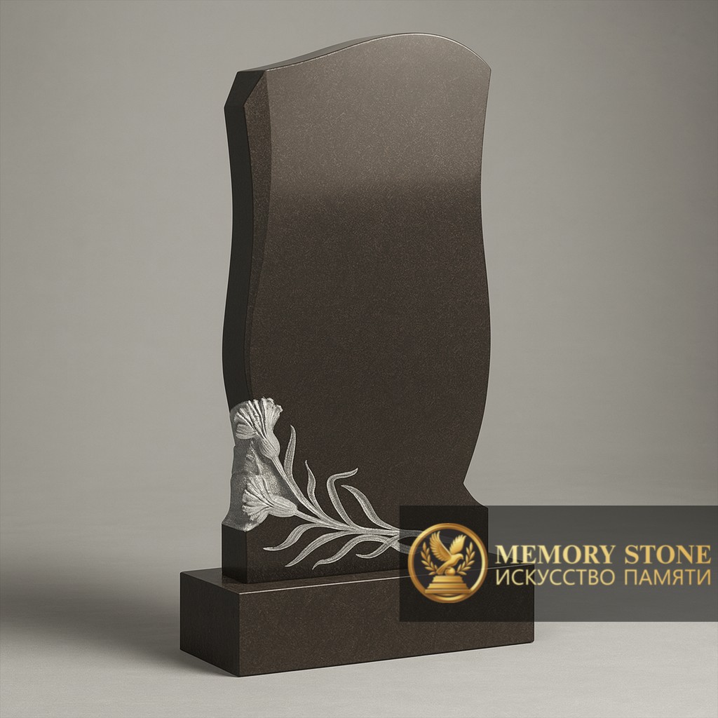 лаконичный памятник с гравировкой ветви внизу на темном камне