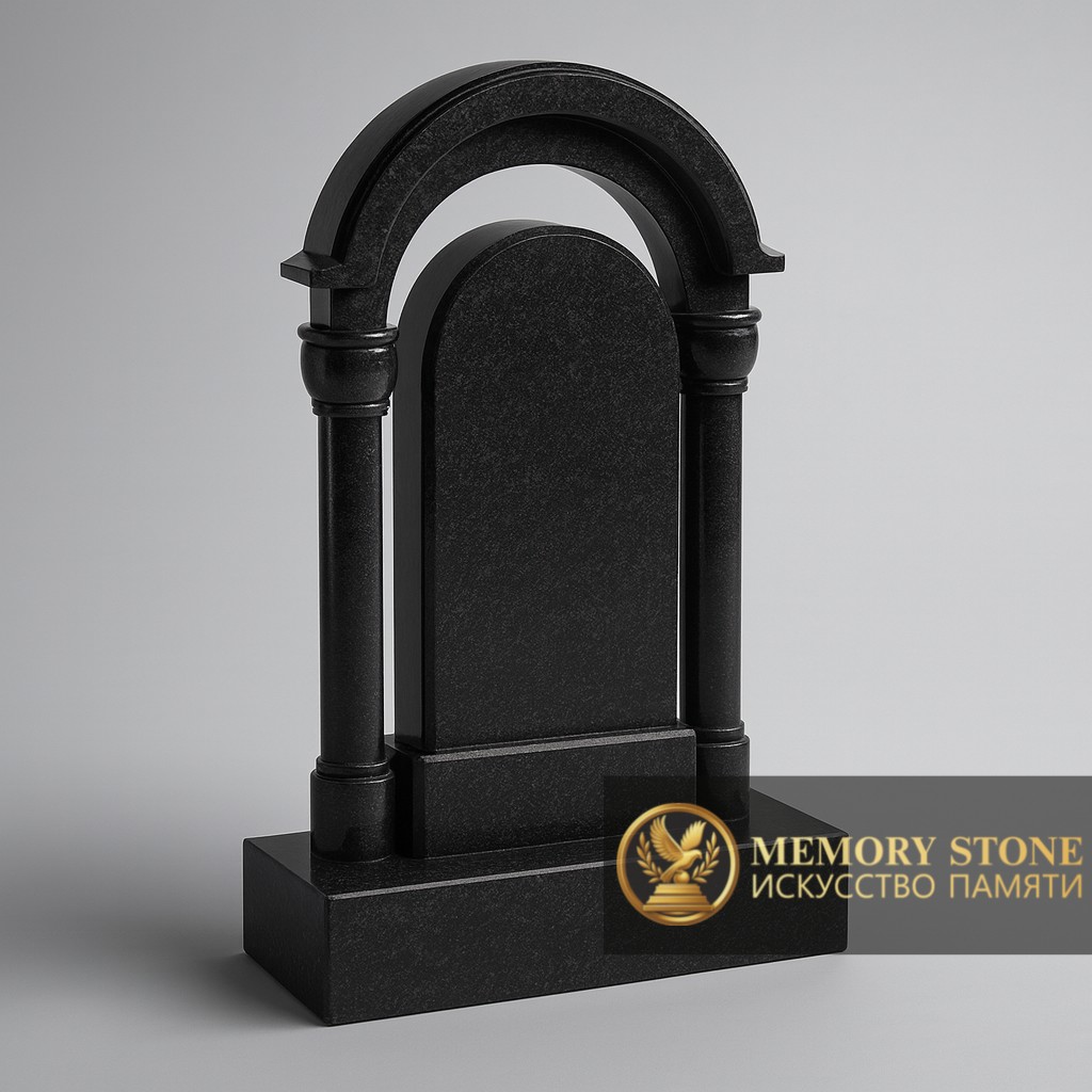 массивный памятник с полукруглым сводом и резными элементами на могилу