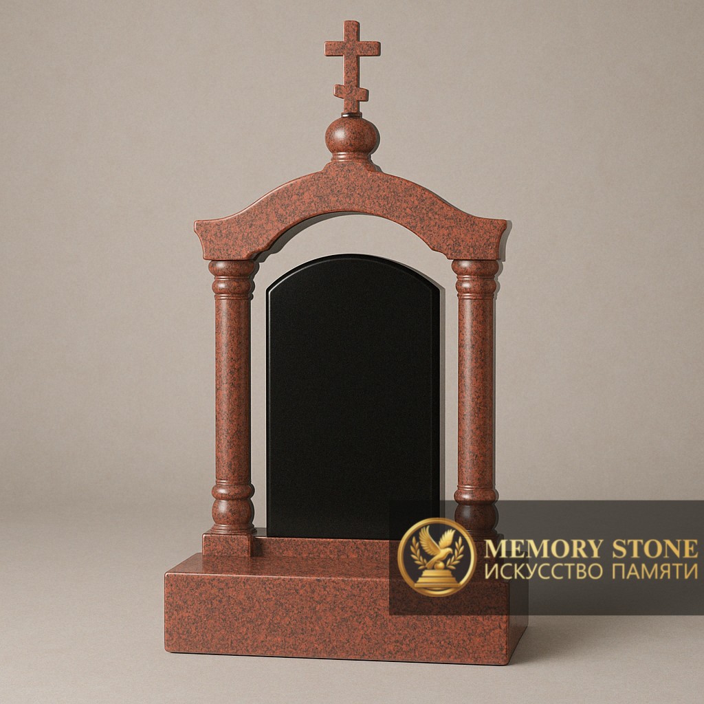 массивная арка из красного камня с крестом на крыше и черной стелой