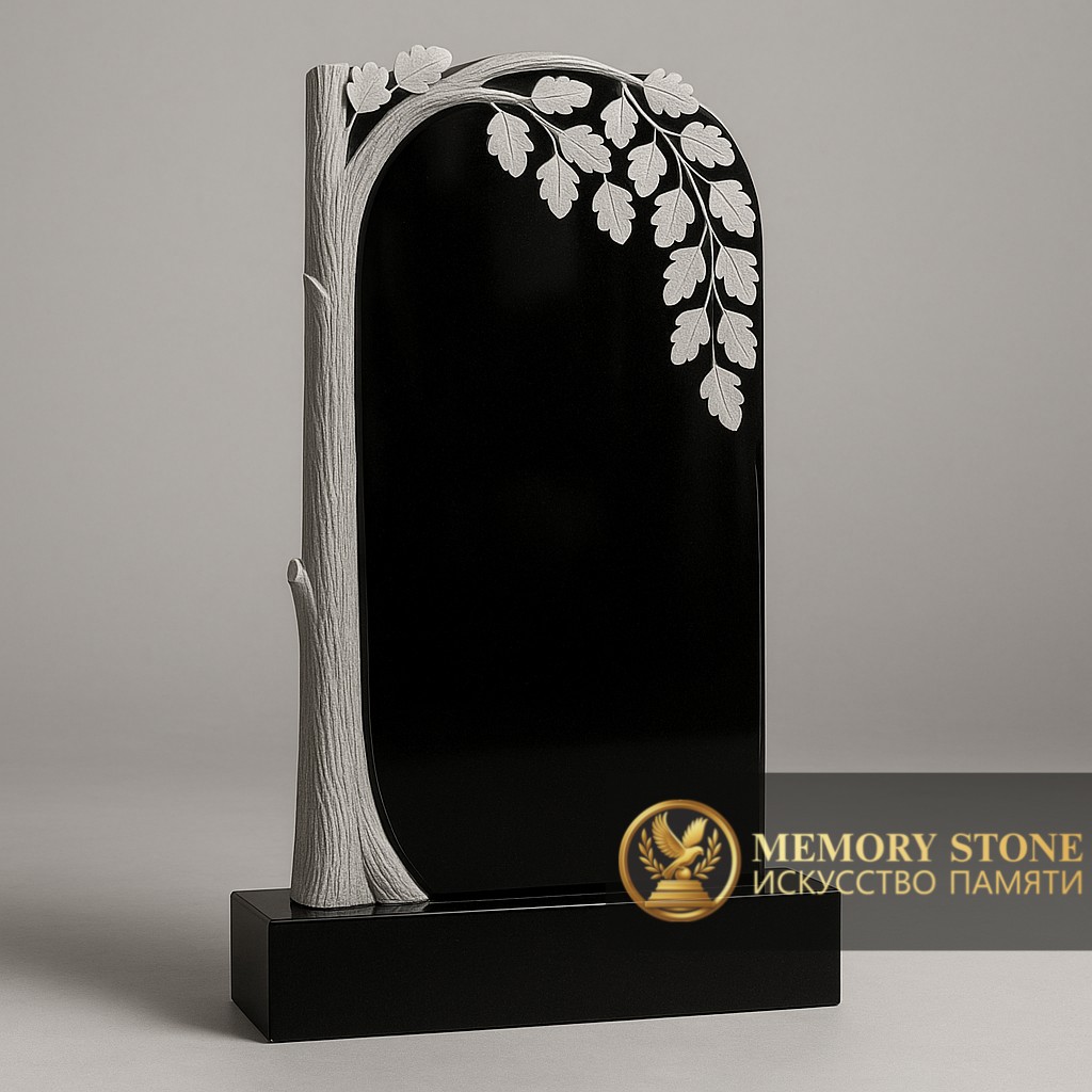 вертикальное надгробие из габбро с барельефом дерева и листьями сбоку